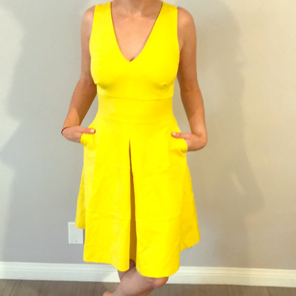 Yellow cross back fit and flare dress